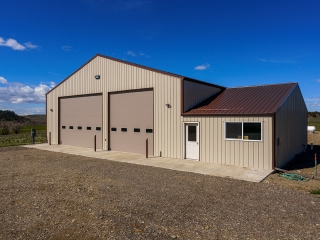 50'x102' shop, 14' doors, 20' sides, 2 heaters & spray foam insulated walls & ceiling