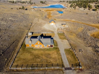 Home, barn and pond aerial view